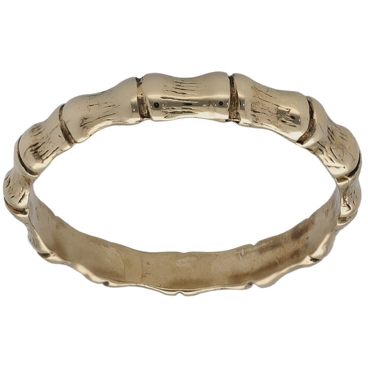 Gold bamboo-style dress ring with hammered texture band and polished bezel details