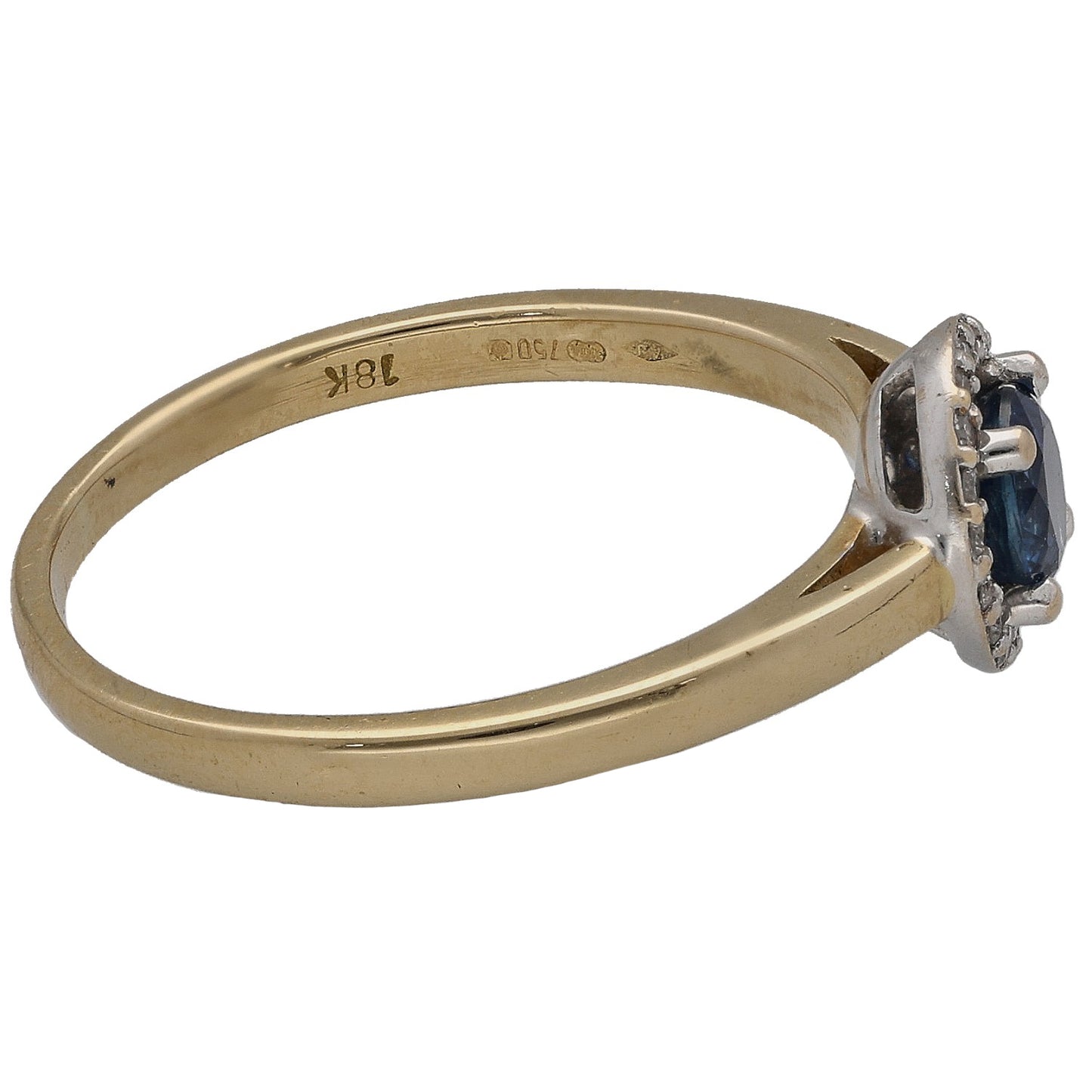 Gold ring side view with round blue sapphire set in prongs and diamond accents