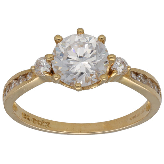 Gold-tone CZ single-stone ring with round center and small halo accents