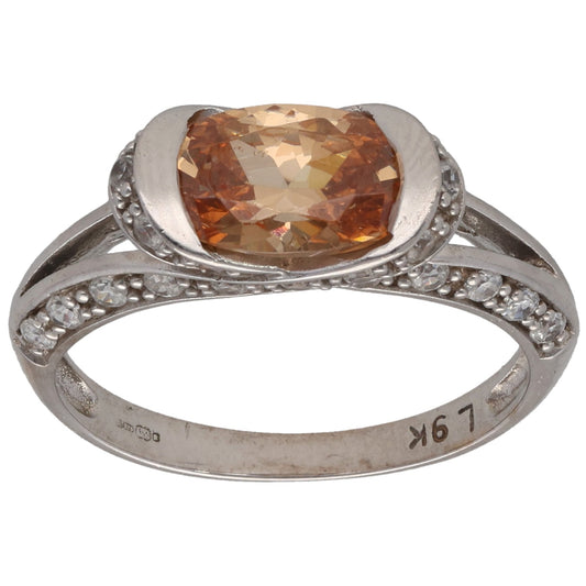 9ct white gold cocktail ring with orange CZ and pavé side stones, size N