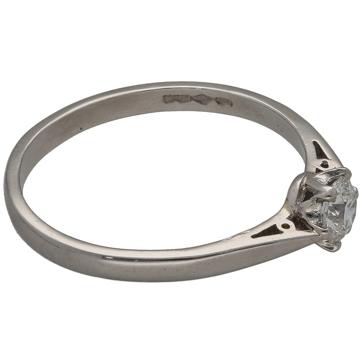 Platinum solitaire diamond ring with round center stone in four-prong side view