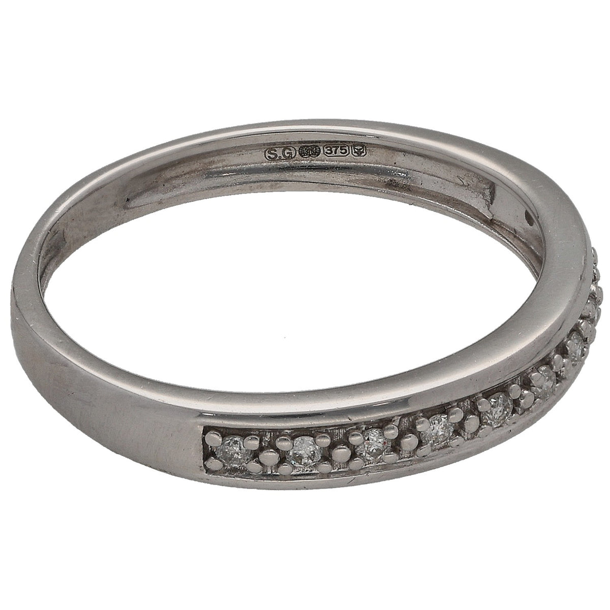 White gold half eternity ring with round diamonds and hallmark stamp on inner band