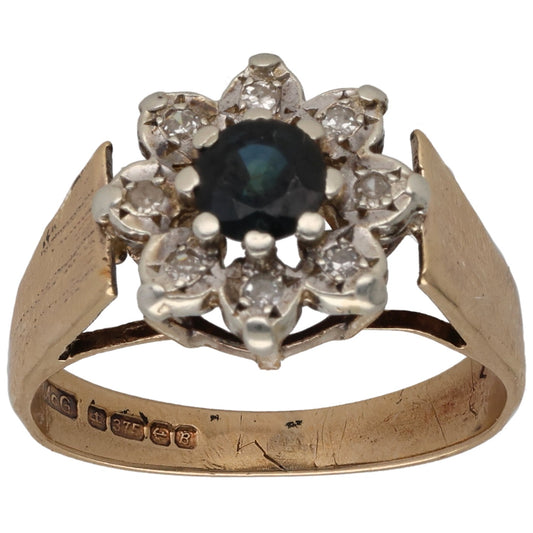 9ct gold dress ring with dark blue-green sapphire and round diamond cluster