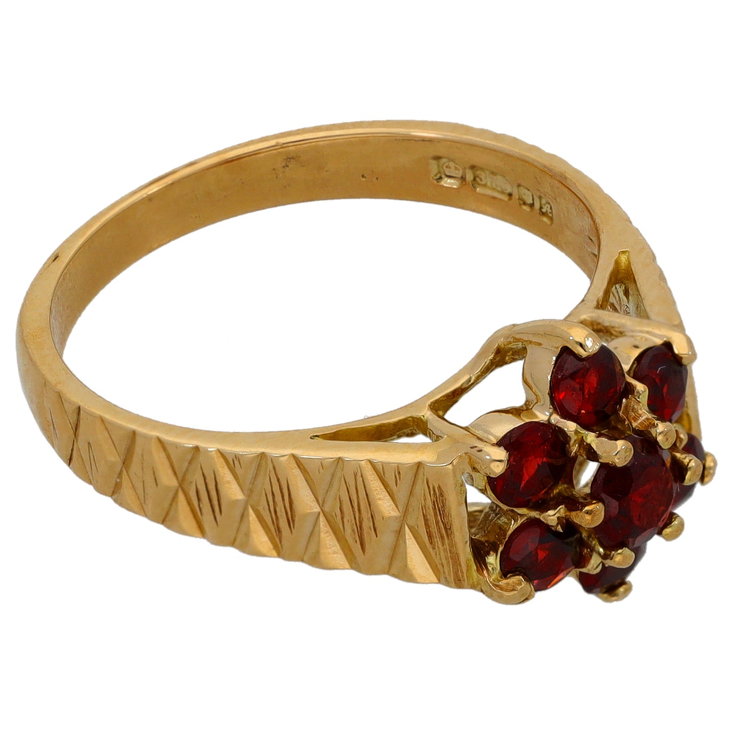 Gold cocktail ring with red gemstone cluster and ridged band, size O