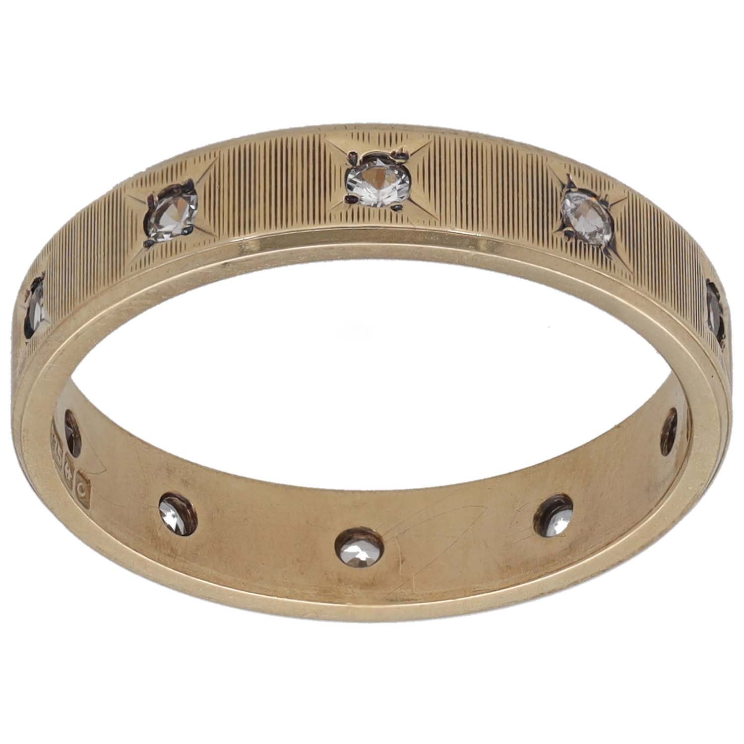 Gold-tone CZ patterned wedding ring, domed band with three sparkling stones and side detail