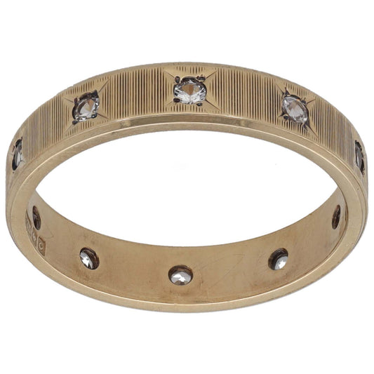Gold-tone CZ patterned wedding ring, domed band with three sparkling stones and side detail
