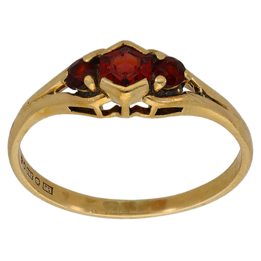 9ct gold three-stone garnet ring with red center and two side stones