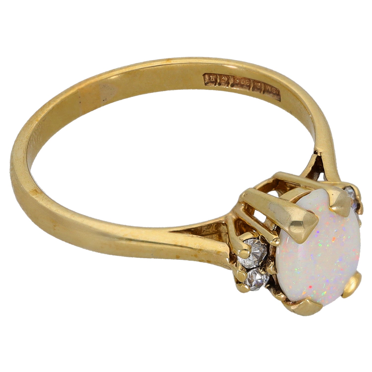 Gold single-stone ring with opal-like oval setting and small clear side accents