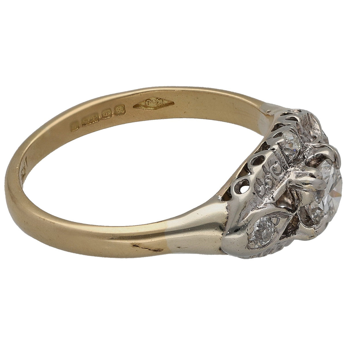 Yellow gold ring with round diamond cluster at side and polished band