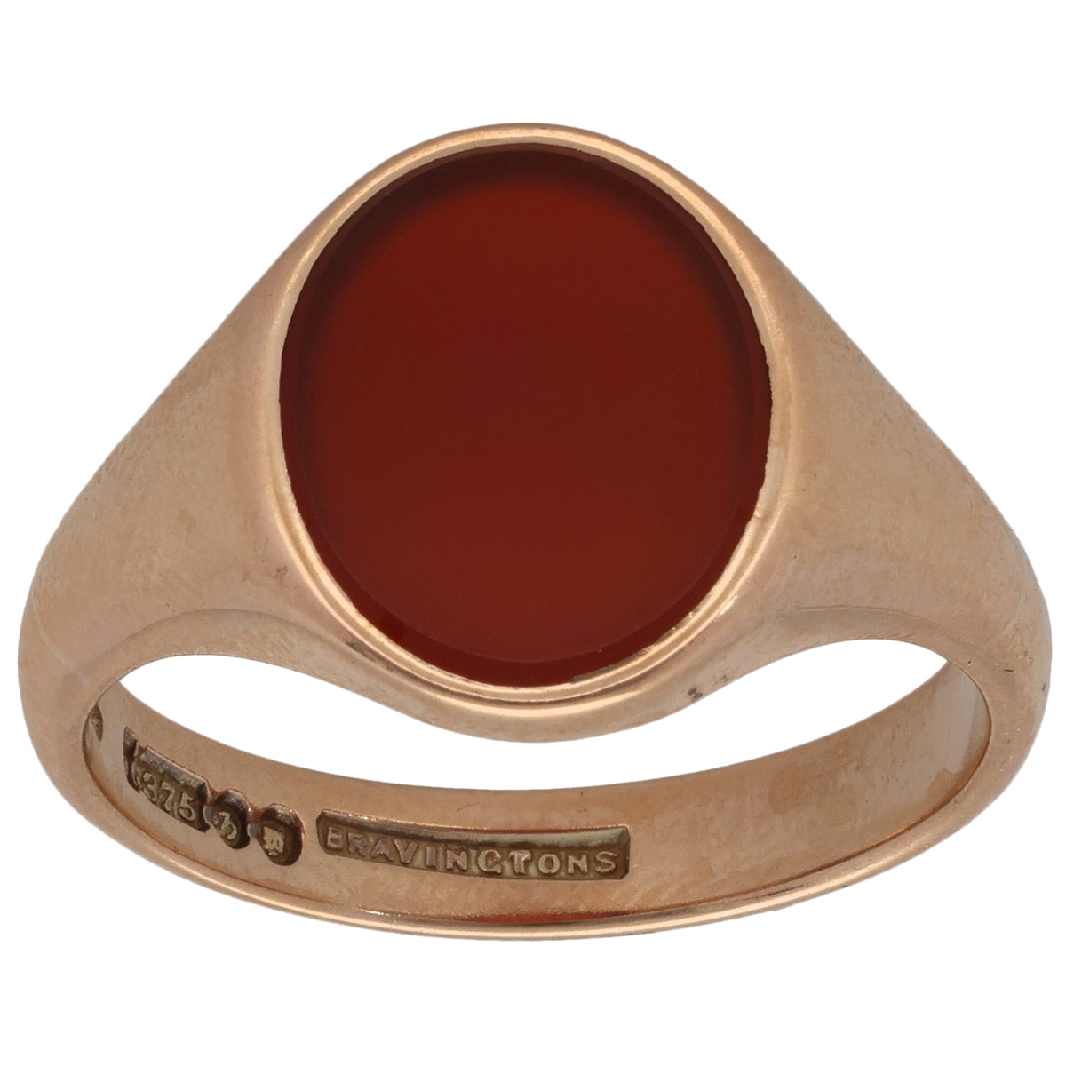 Gold signet ring with oval red carnelian stone and slim plain band