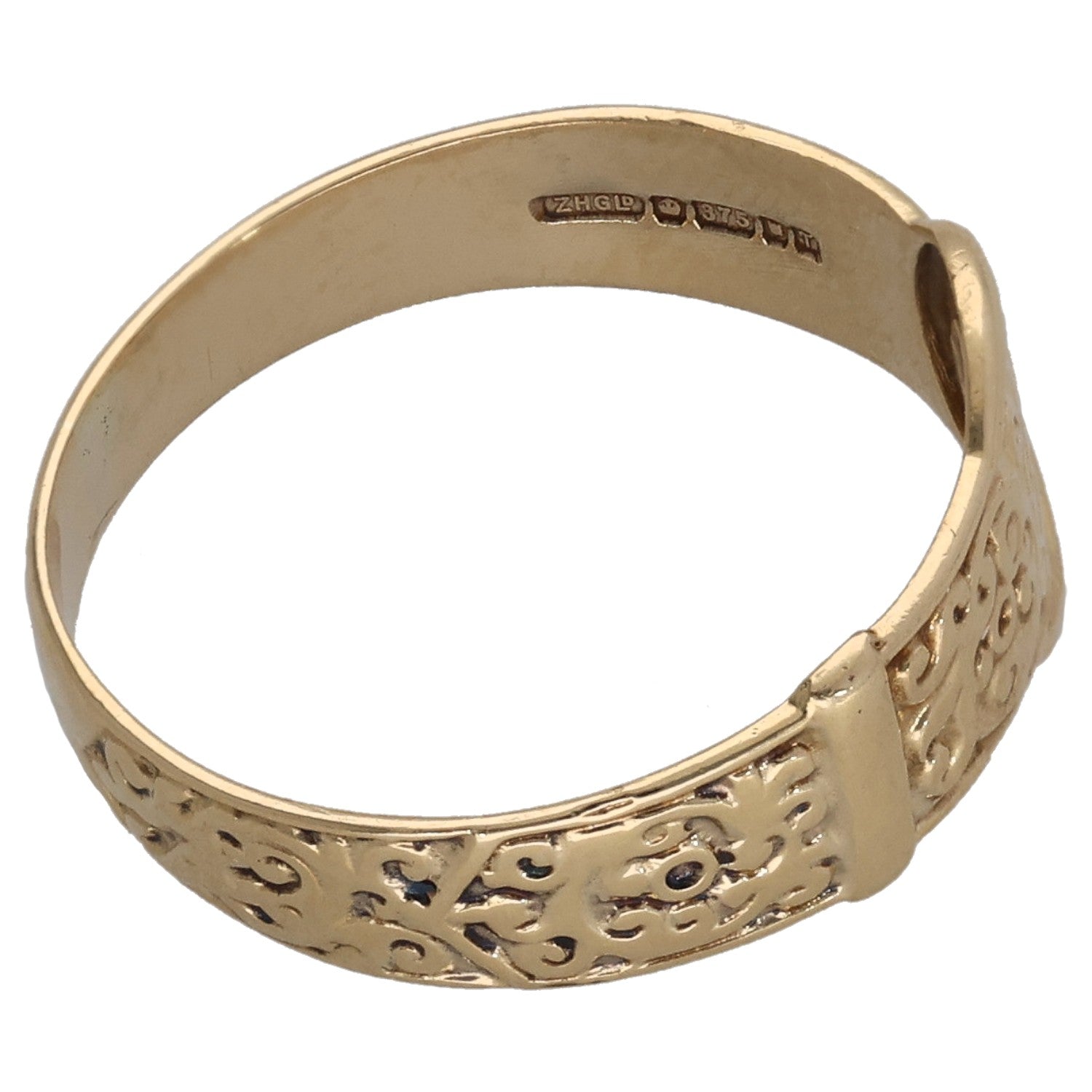 Gold buckle ring with interior stamp and embossed filigree pattern on band