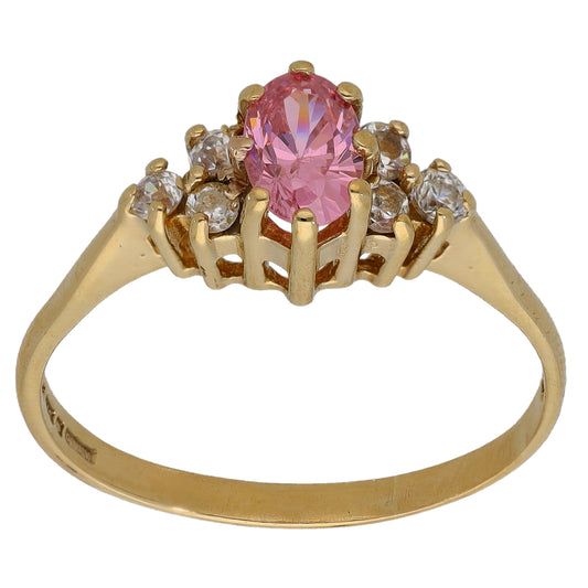 Gold CZ ring with oval pink center stone and small clear side stones, raised setting