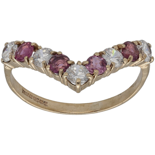 Gold wishbone ring with oval purple ruby center and clear CZ side stones