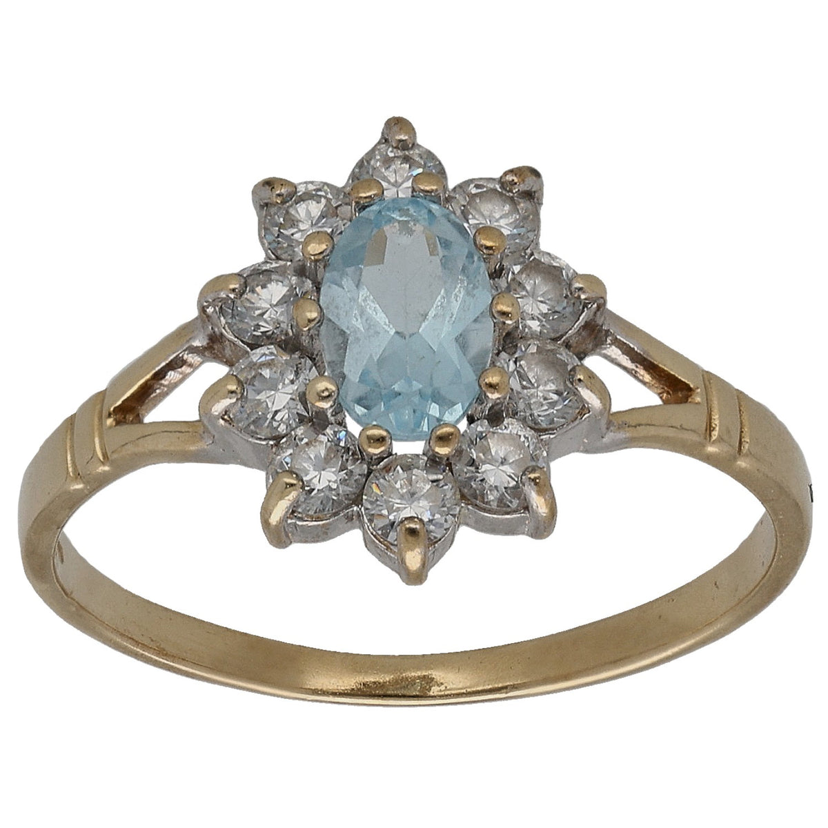 Gold cocktail ring with blue topaz center and sparkling clear CZ cluster halo