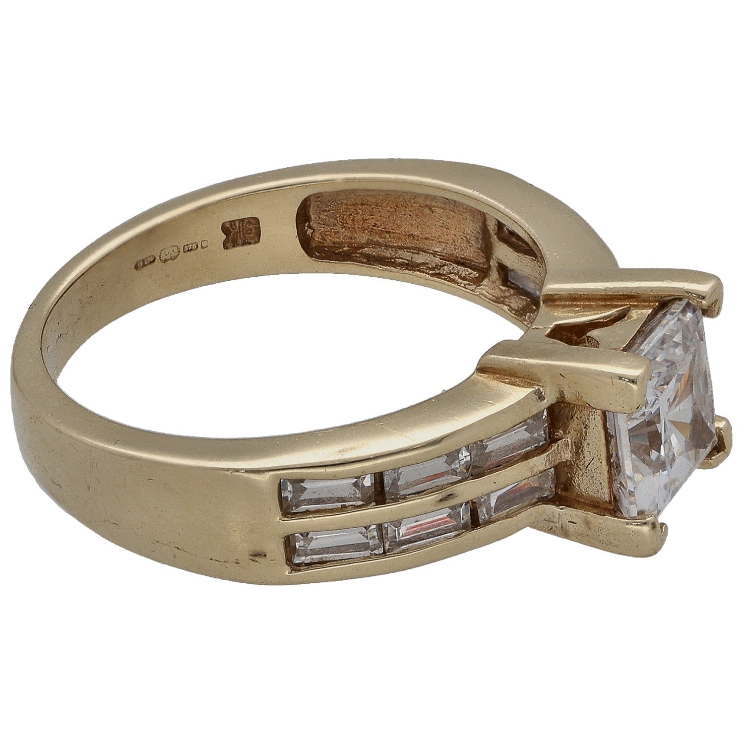 Gold ring with square CZ stone and baguette side stones