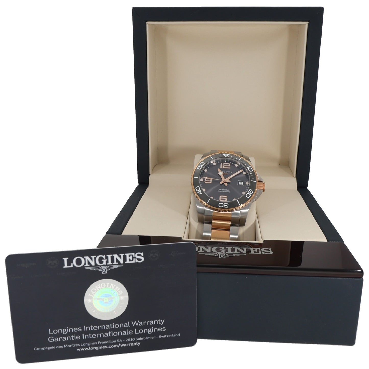 Longines Hydro Conquest watch in gift box with black dial and gold bezel.