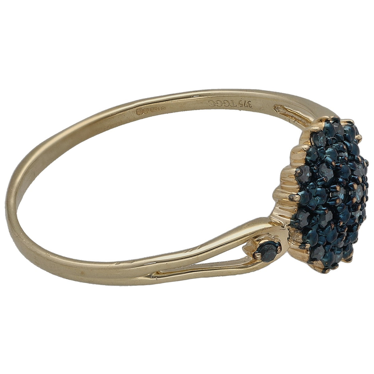 Gold ring with dark blue round cluster gemstone on bezel, angled side view