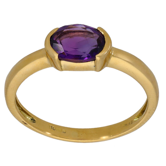 Gold ring with large oval faceted purple amethyst stone and raised bezel setting