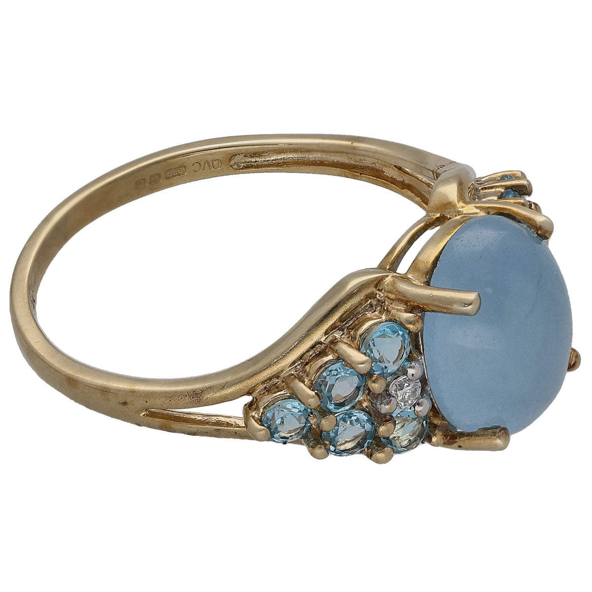 Gold ring side view with oval blue topaz set above blue stones and small diamonds