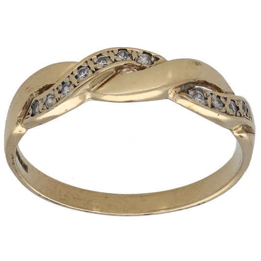 Gold-tone ring with channel-set clear CZ stones across the top band