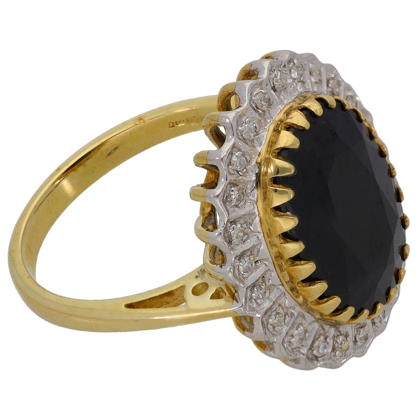 Gold cocktail ring side view with oval dark center gemstone, diamond-like halo and prongs