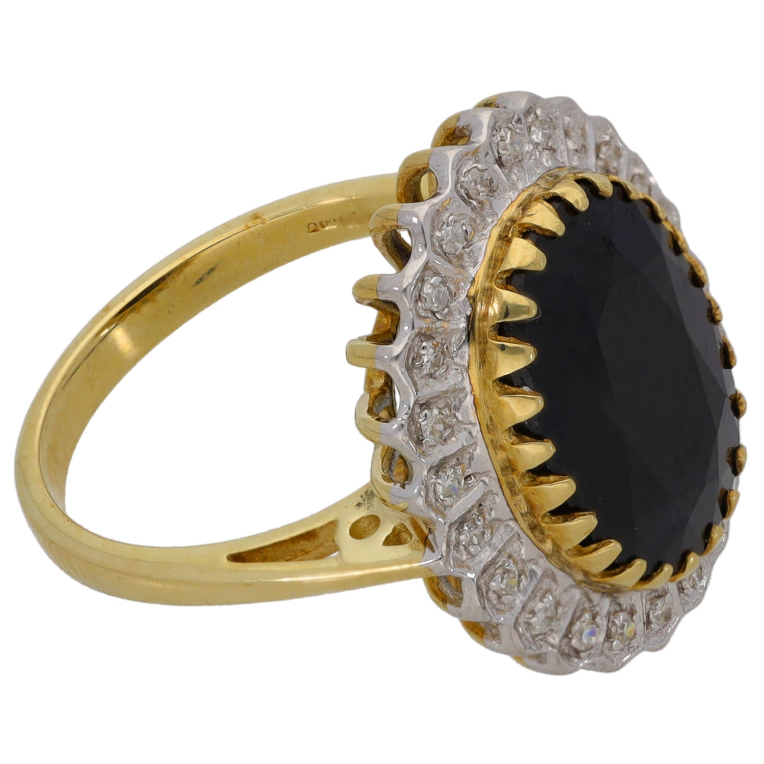 Gold cocktail ring side view with oval dark center gemstone, diamond-like halo and prongs