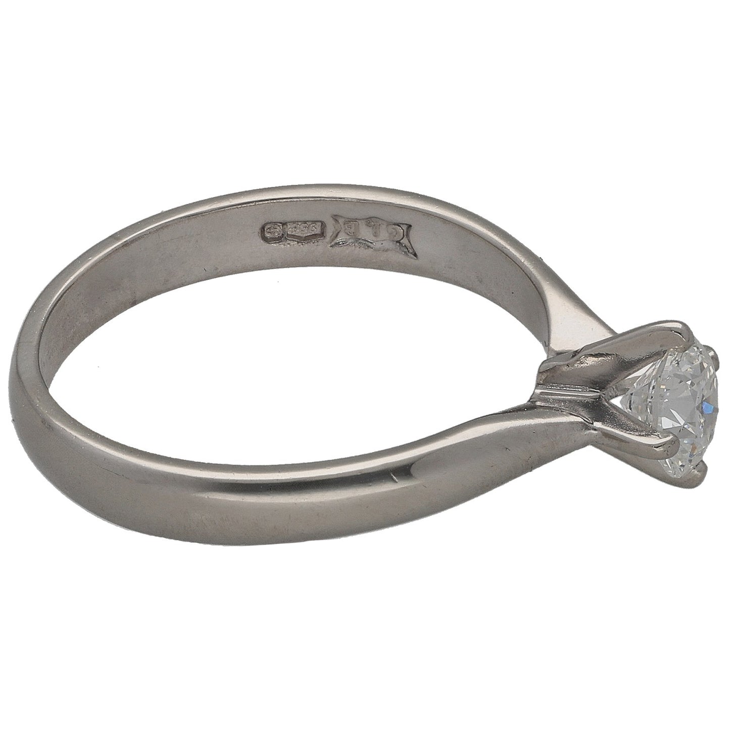 Platinum solitaire diamond ring, side view with round stone and engraved band