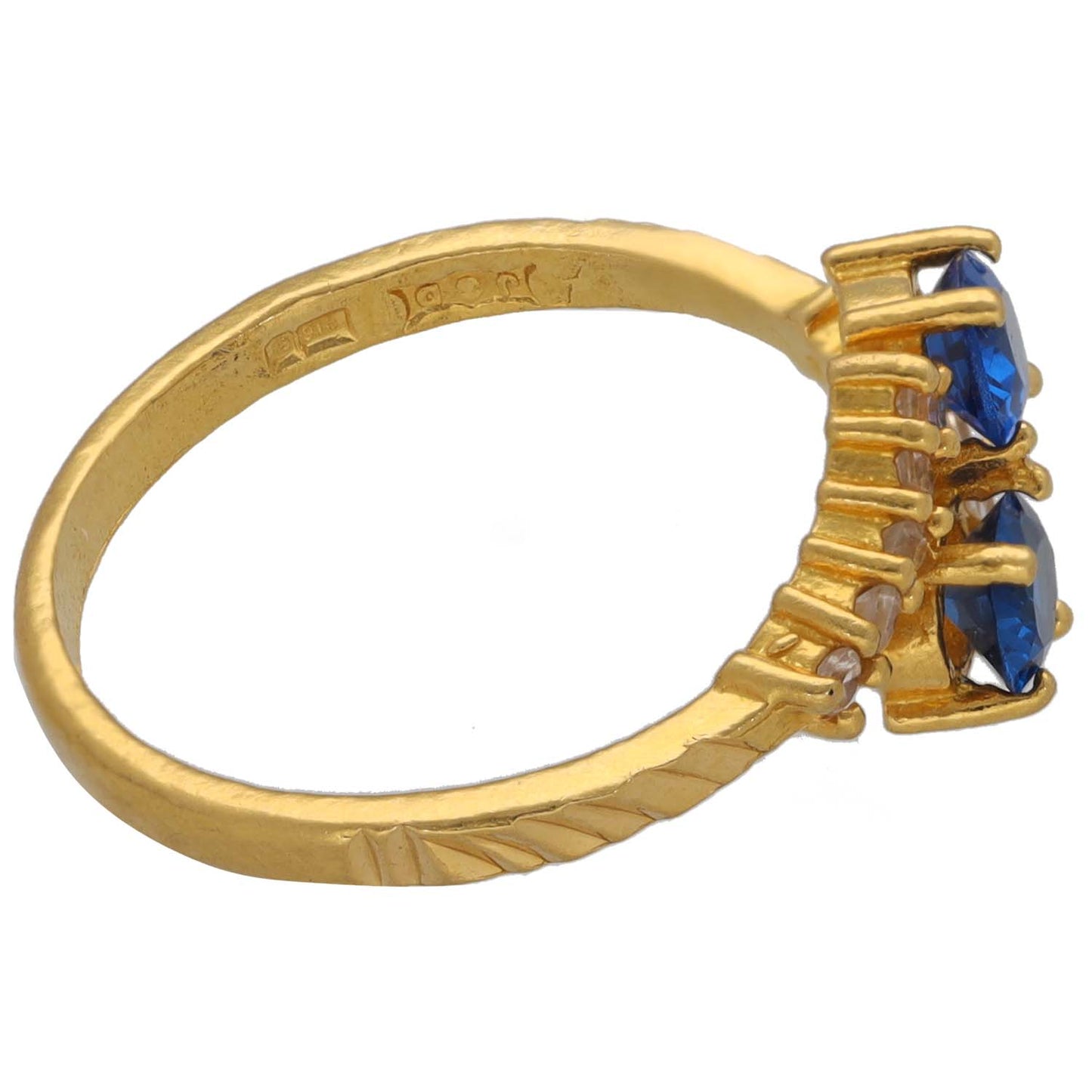 Gold-tone ring band with engraved edge and blue stone side setting, size M