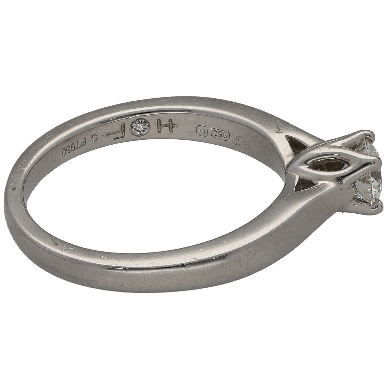 Platinum round diamond solitaire ring side view with inner hallmark markings