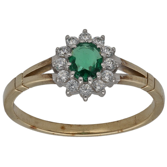 Gold-tone imitation ring with green center stone and clear diamond-style accents