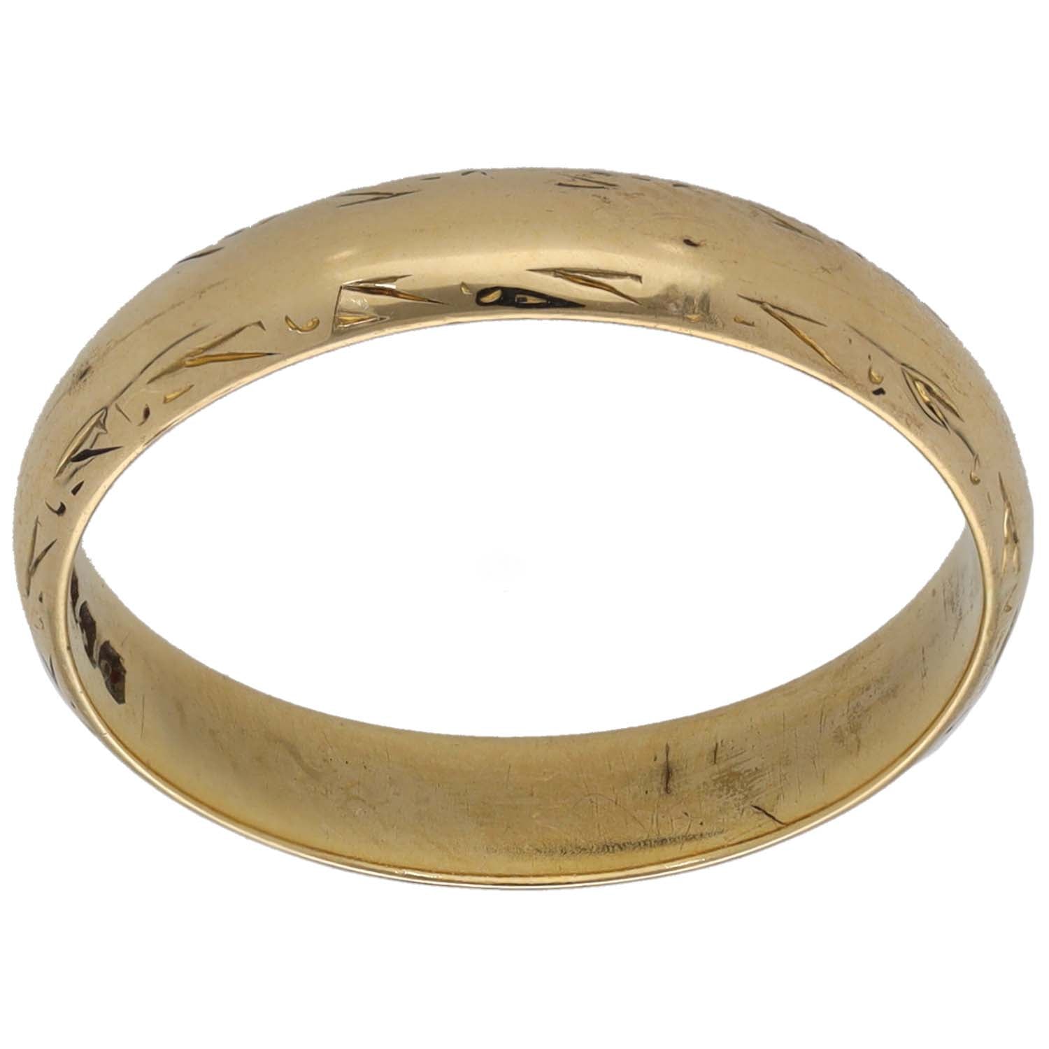 Gold wedding ring band with subtle engraved pattern, plain profile