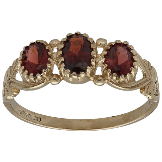 9ct gold three-stone garnet ring with three dark red oval stones