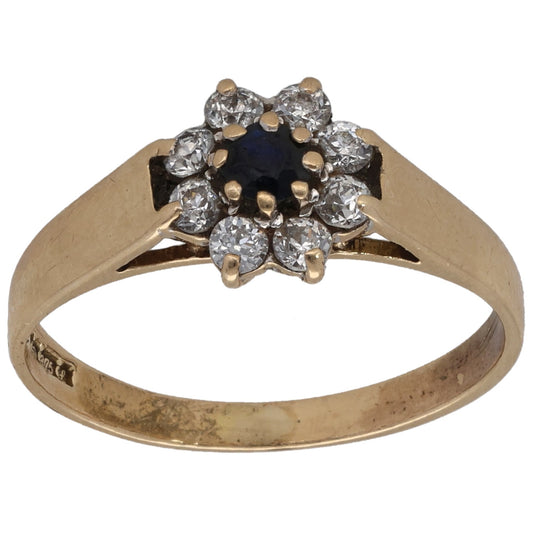 9ct gold dress ring with dark center stone and clear CZ cluster at top
