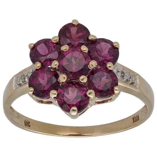 Yellow gold cocktail ring with maroon garnet cluster and small round diamonds