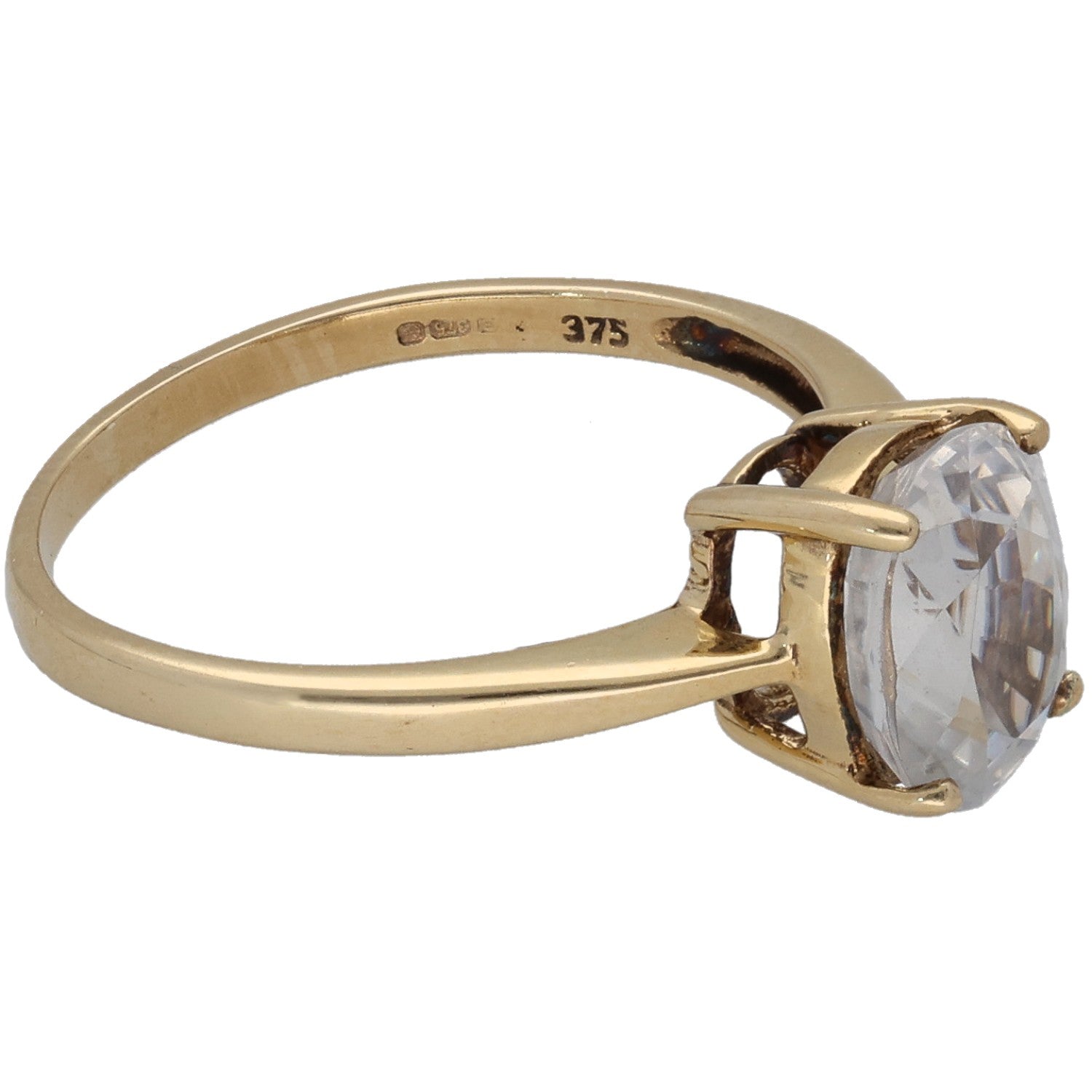9ct gold ring with side-set oval clear zircon, open prongs, visible inside hallmarks