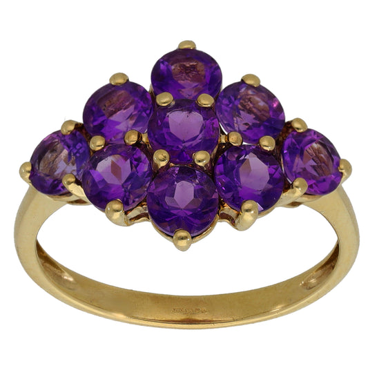 Gold cocktail ring with rounded purple amethyst cluster in gold prong setting