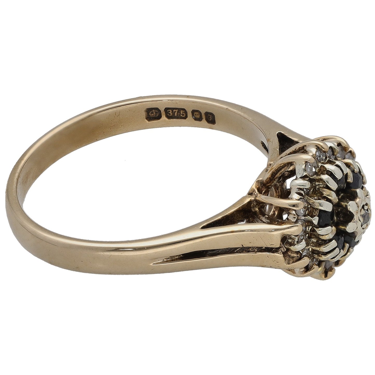 9ct gold cocktail ring with dark gemstone setting and visible inner hallmark