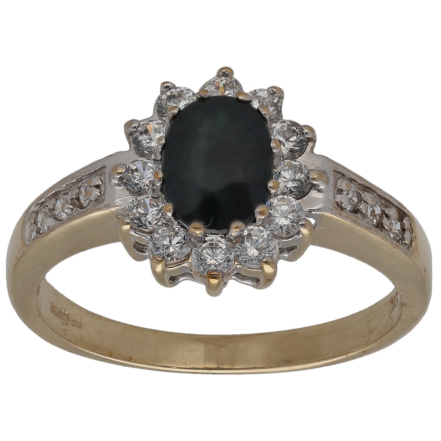 Gold dress ring with oval dark center stone and round clear stones halo