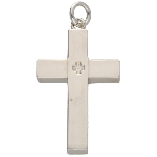 Sterling silver cross pendant with small relief cross in center, loop bail at top.