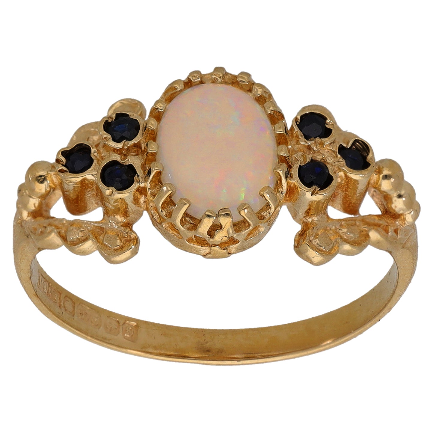 9ct gold ring with oval opal center, claw-set dark sapphire accents, size Q
