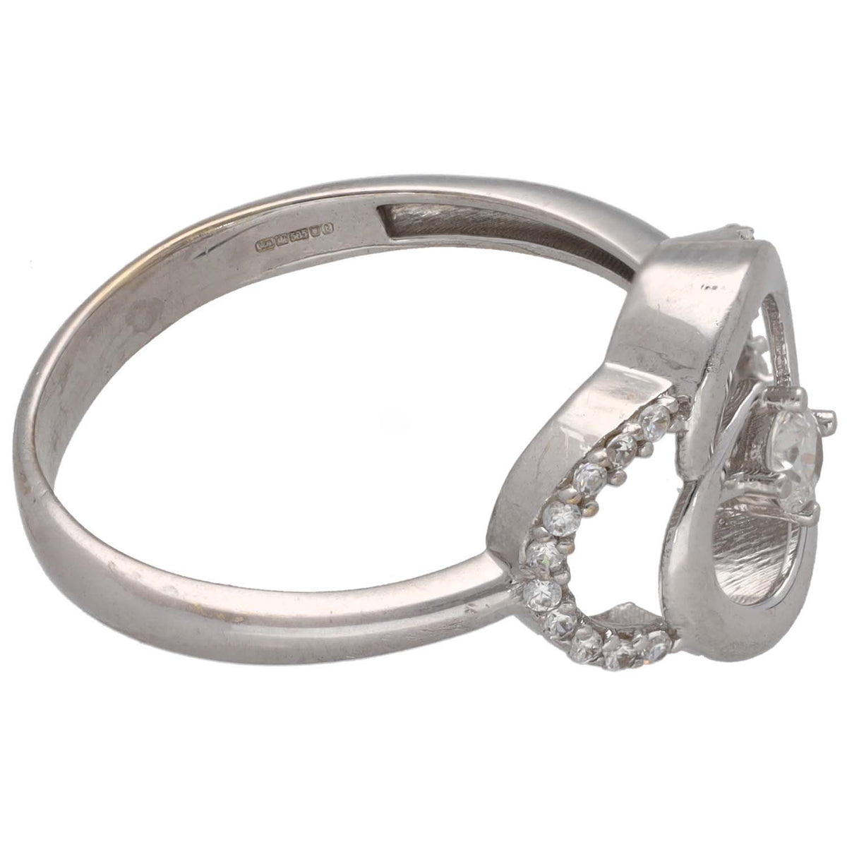 White gold-tone CZ ring with oval top stone and small stones along the band