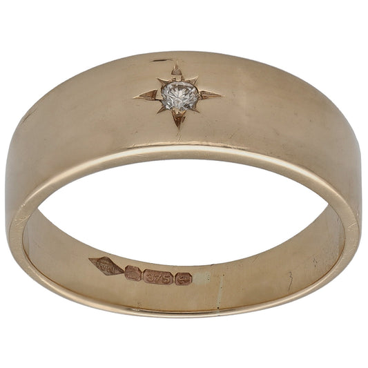 9ct gold solitaire ring with round diamond set on top; inside hallmark visible