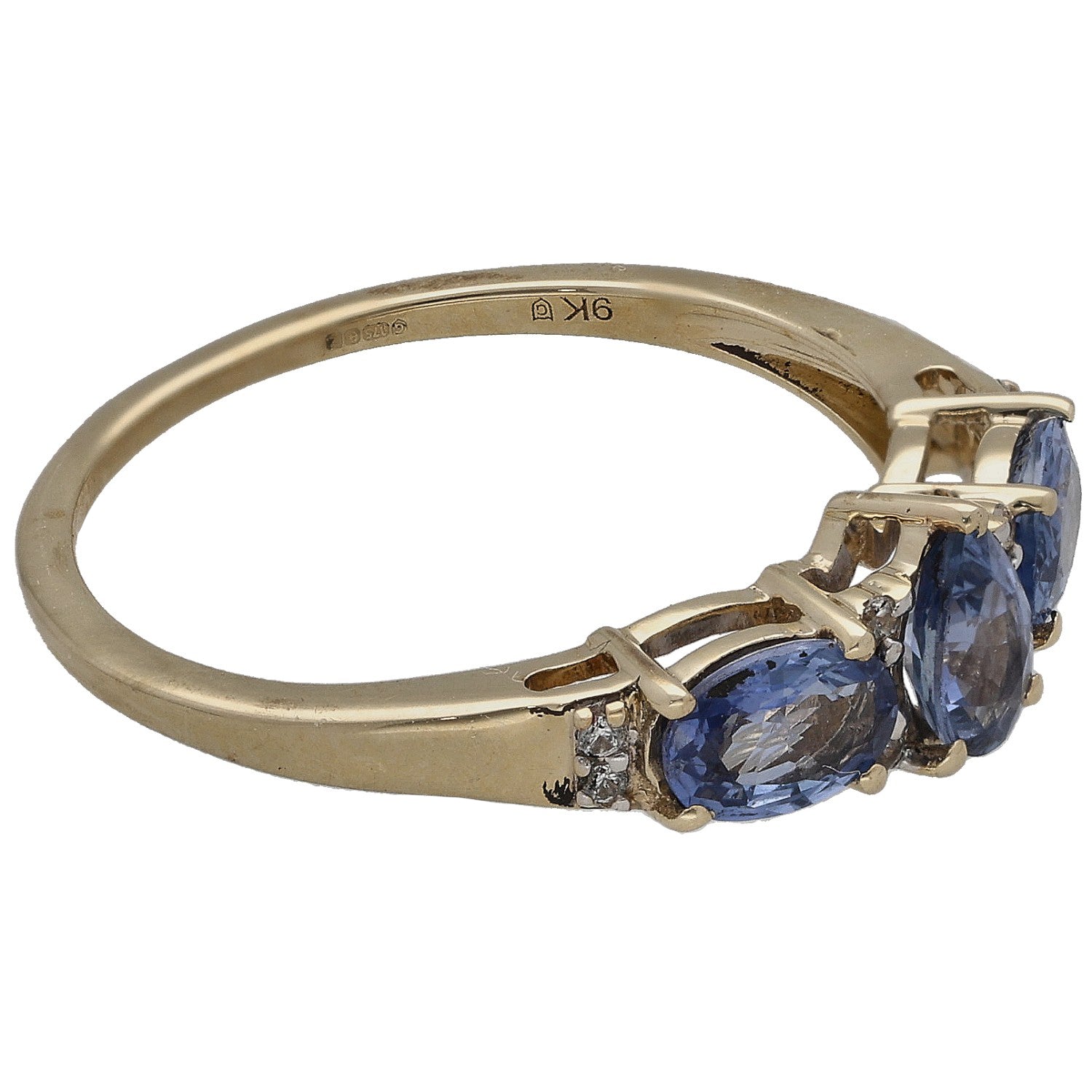 Gold ring side view with three blue oval sapphires and small round diamond accents