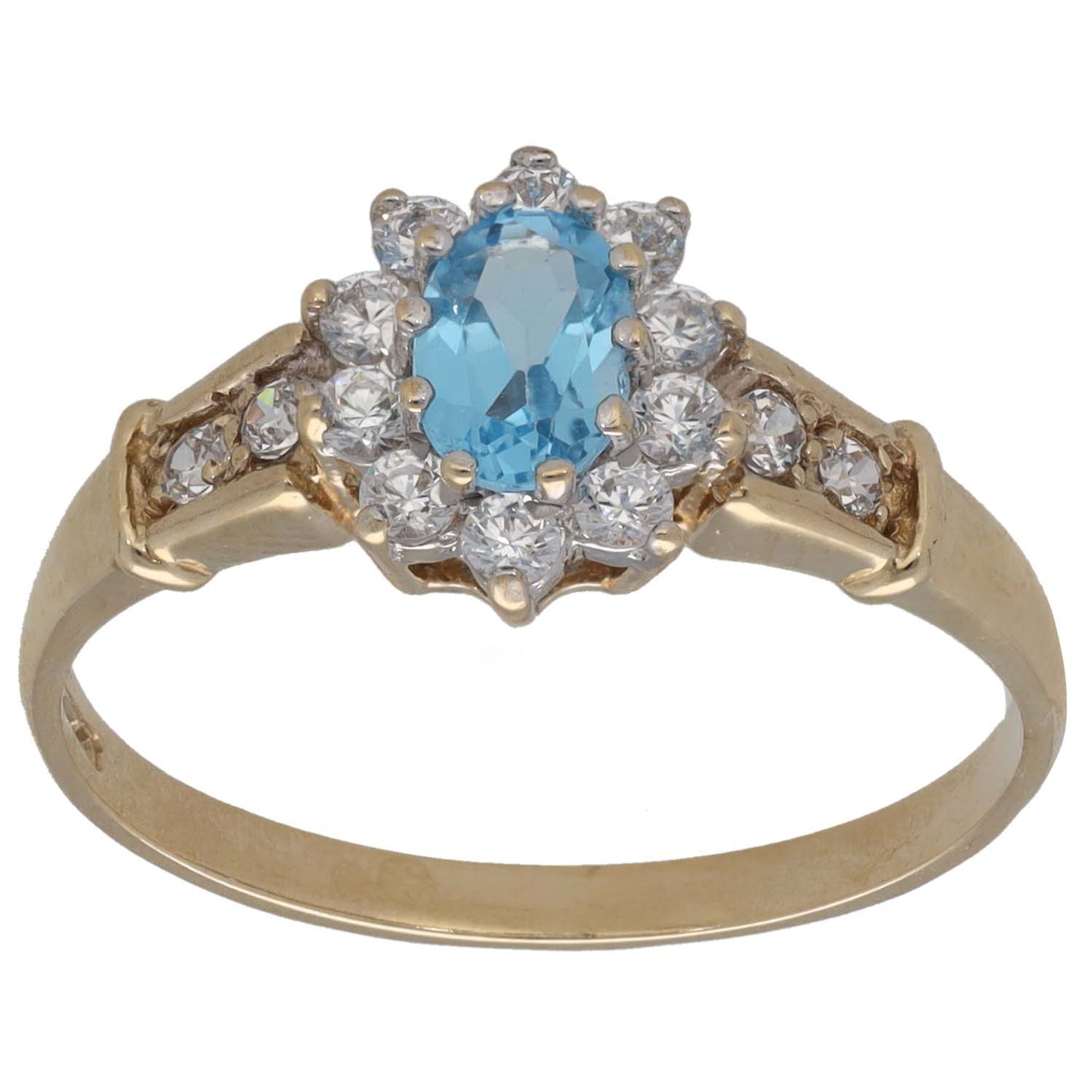 Gold cocktail ring with oval blue gemstone center, surrounded by clear CZ stones