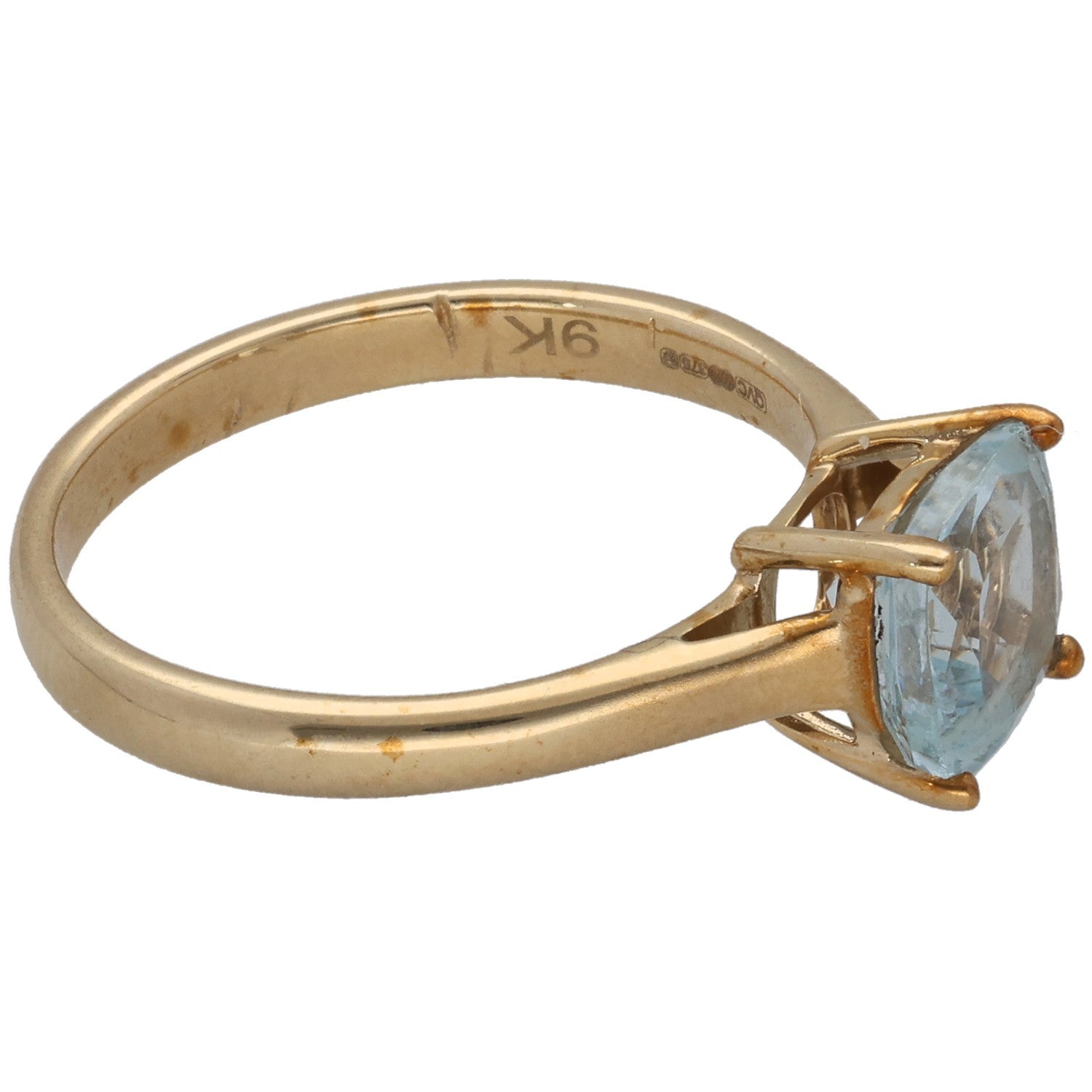 9ct gold ring with light blue aquamarine cushion stone in four-prong setting