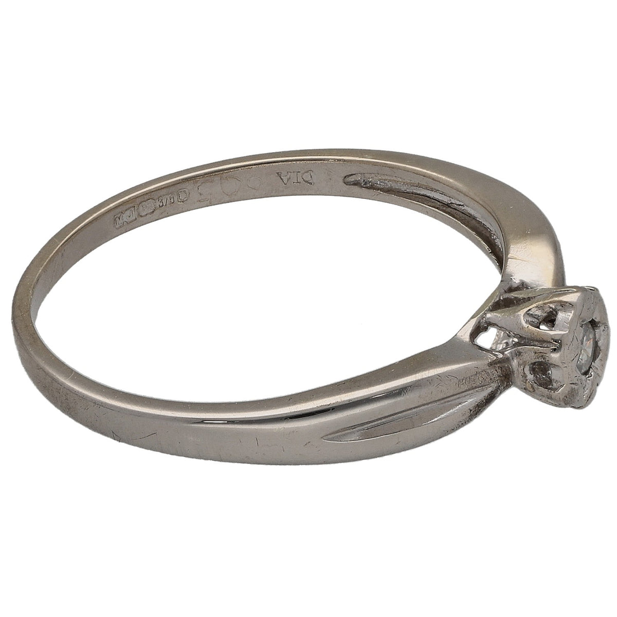 9ct white gold solitaire ring with round diamond in side-mounted four-prong setting