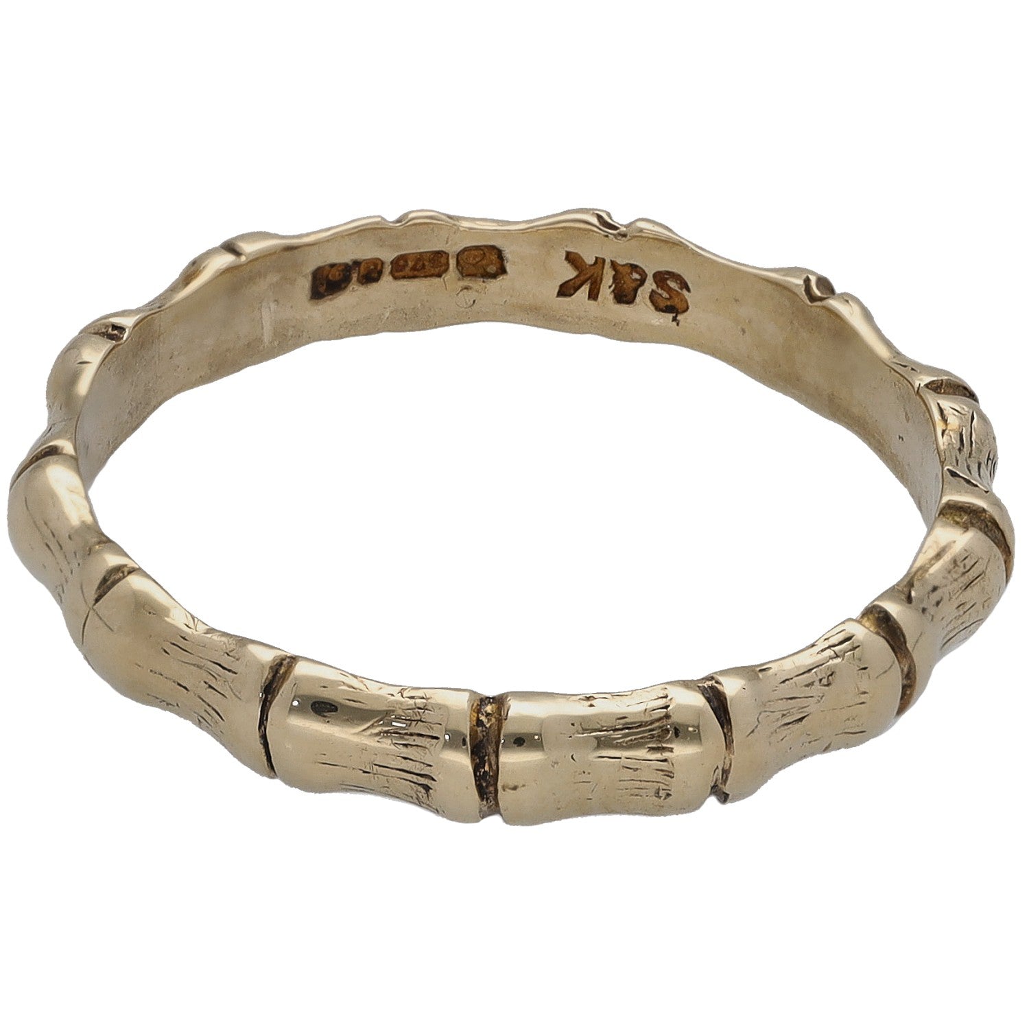 Gold bamboo-style ring band with inner engraving and hallmark marks, polished finish