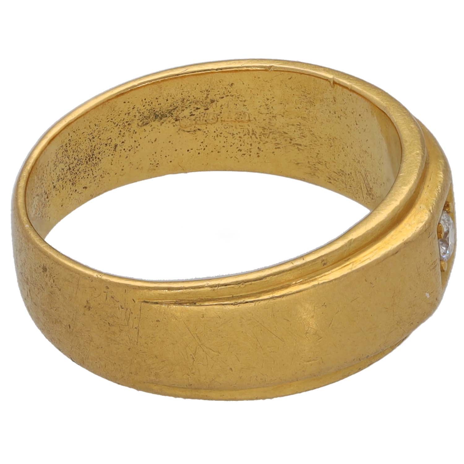 Gold-tone CZ ring band with textured finish and smooth top edge
