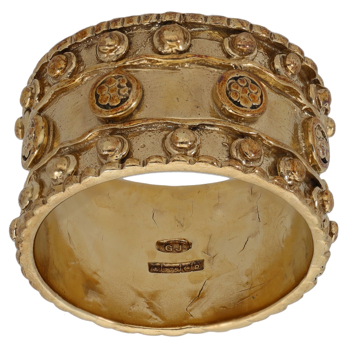 9ct gold wedding ring with raised patterned border and oval top, inner hallmark visible