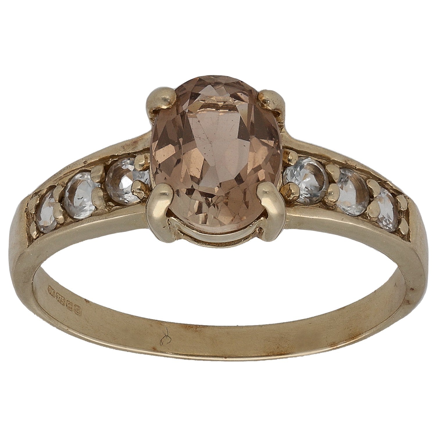 Gold-tone ring with large oval smoky center stone and small clear side accents